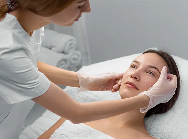 This image shows a informational graphic about skin laxity alongside a practitioner performing a facial treatment on a client 620x460