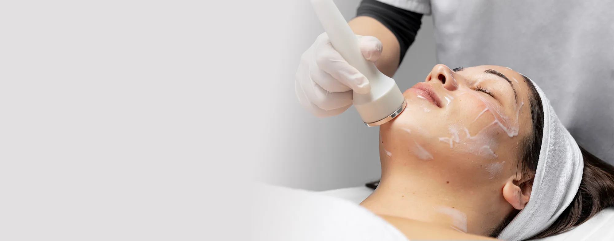 Dermatologist performing advanced facial laser hair removal for smooth, flawless skin 2000x785
