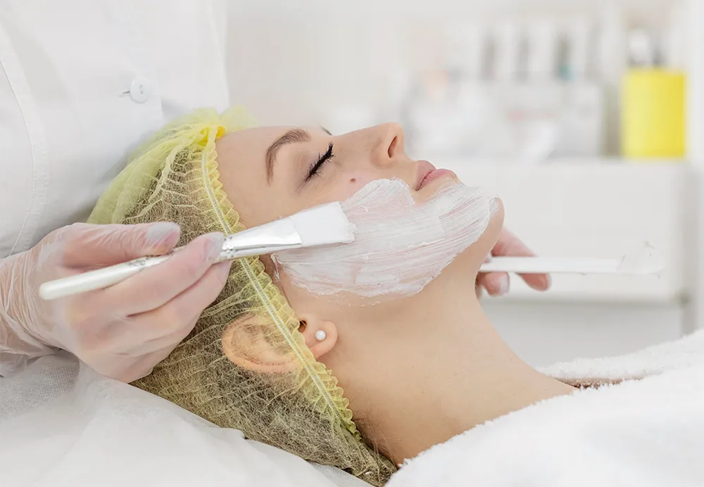 Dermatologist performing a Medi Facial treatment on a patient to improve skin tone and hydration 1000x692