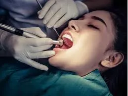 Patient undergoing painless root canal treatment by a dentist at Dermatrix Clinic in Thane West 259x194